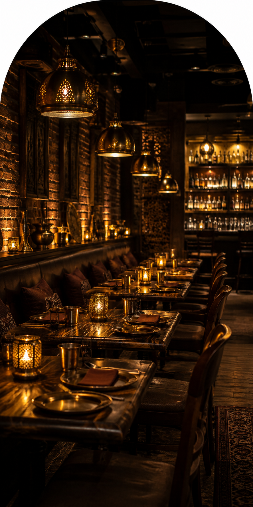 The warm, lamp-lit dining room and bar at Nandini&rsquo;s